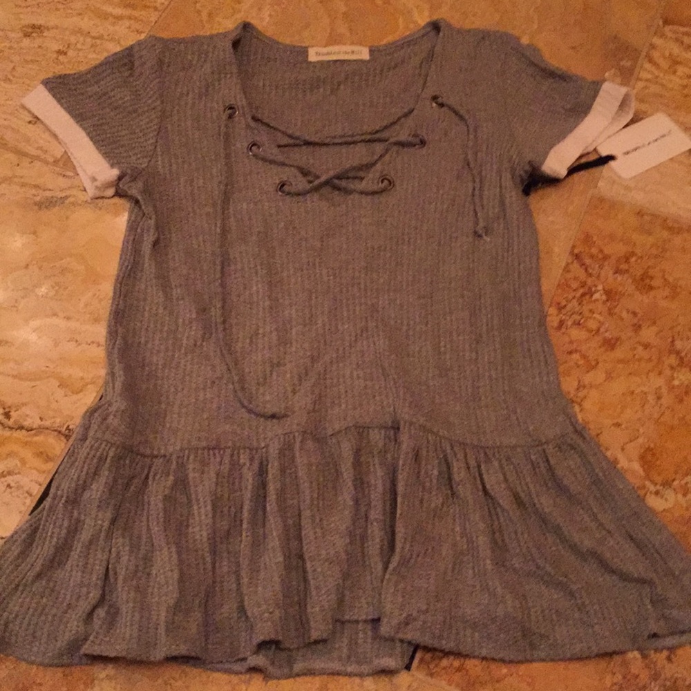 Trouble at the Mill peplum skirt-hem laced V-neck
